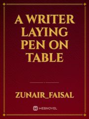 A writer laying pen on table Book